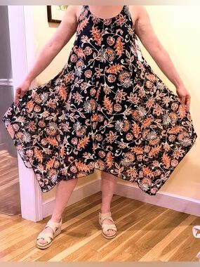 Nina Leonard navy floral asymmetrical sleeveless dress.